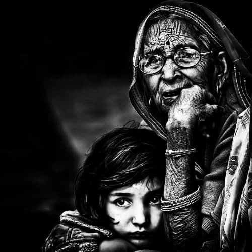 Black-and-white portrait of an elderly woman with a child